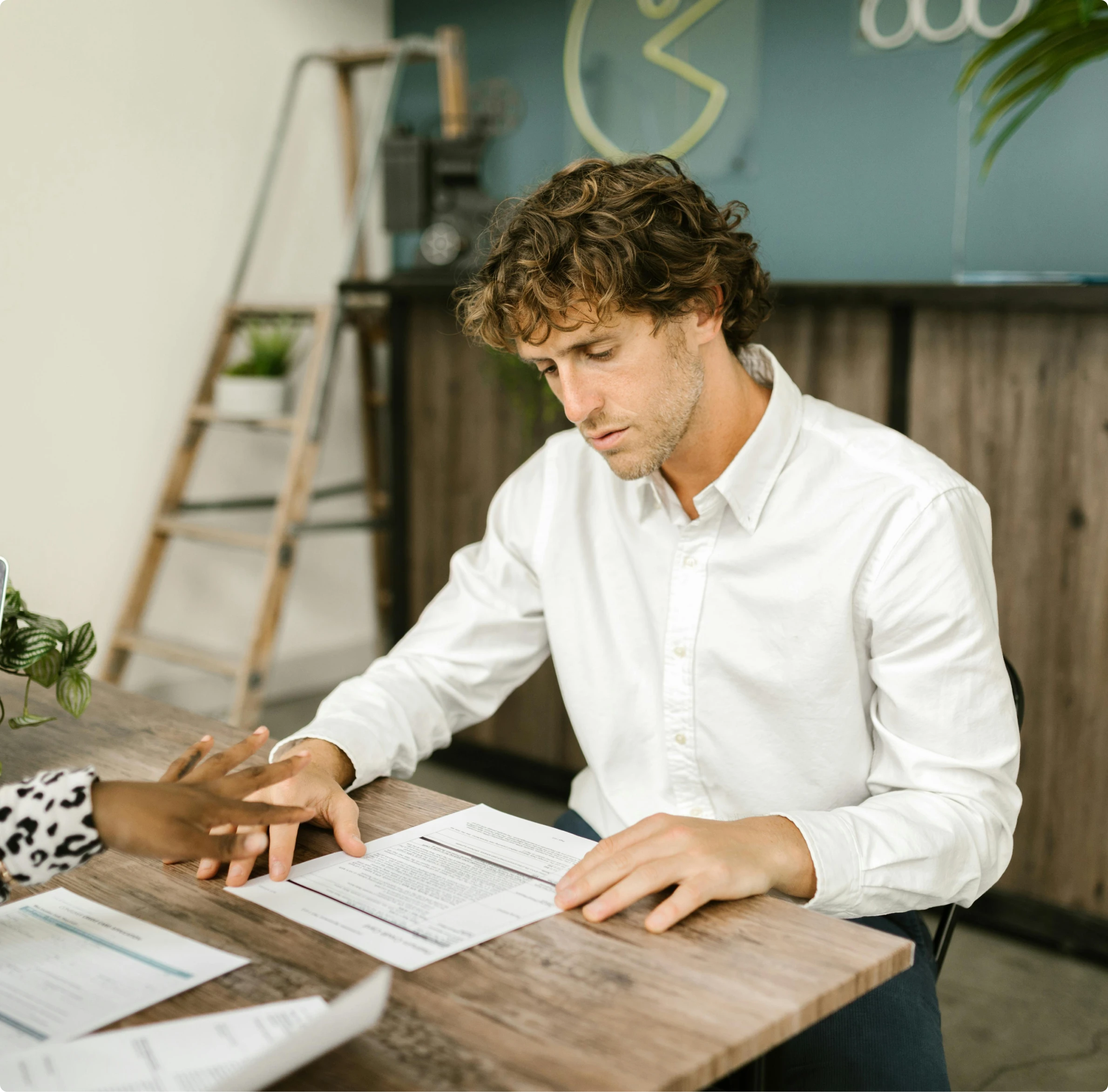 Client reviewing mortgage documents with guidance from MambaCap Financial mortgage broker services for home loans and real estate financing.