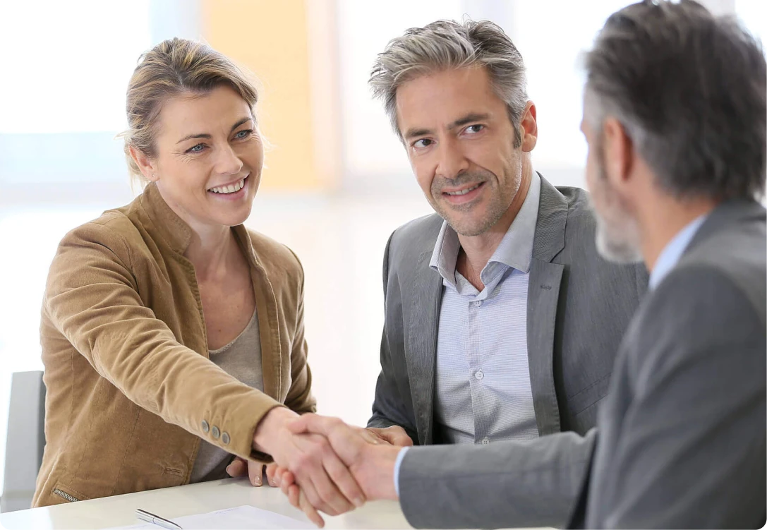 Clients meeting with a mortgage broker from MambaCap Financial to finalize home loan and real estate financing solutions.