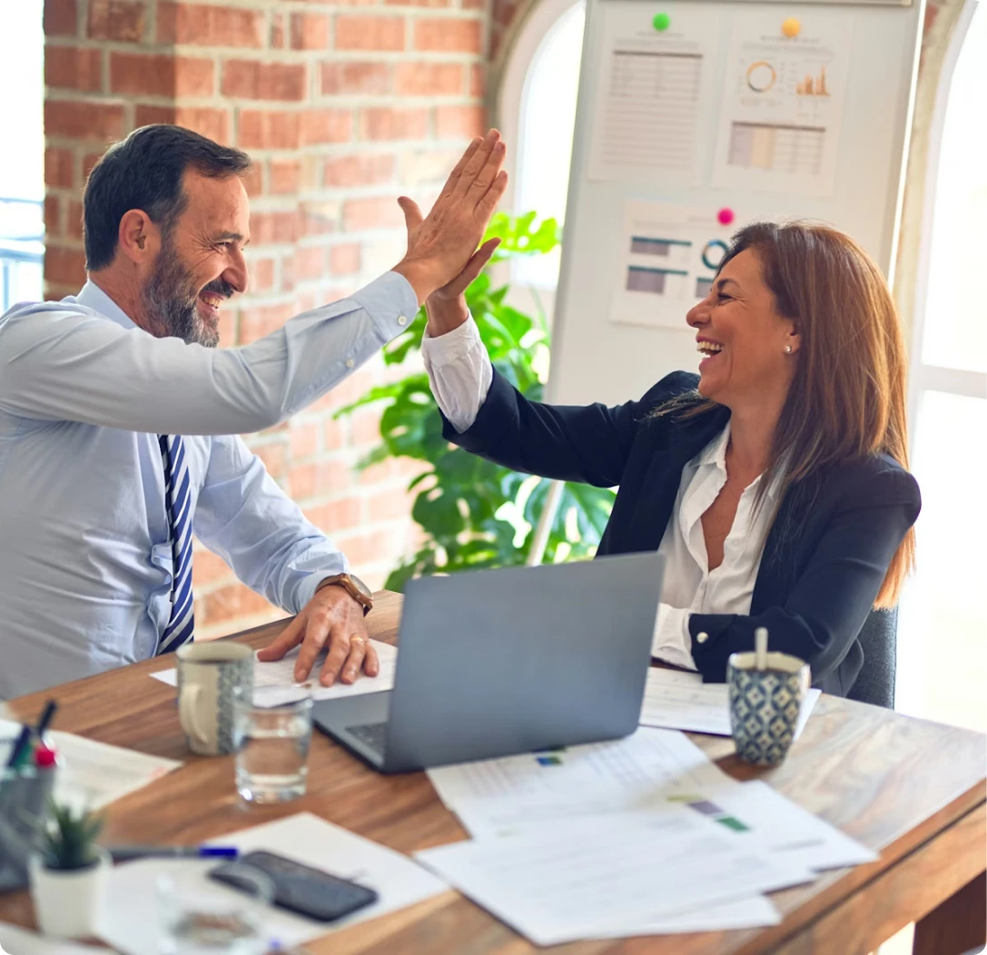 Clients celebrating successful mortgage loan approval with a mortgage broker from MambaCap Financial for home loan and real estate financing solutions.