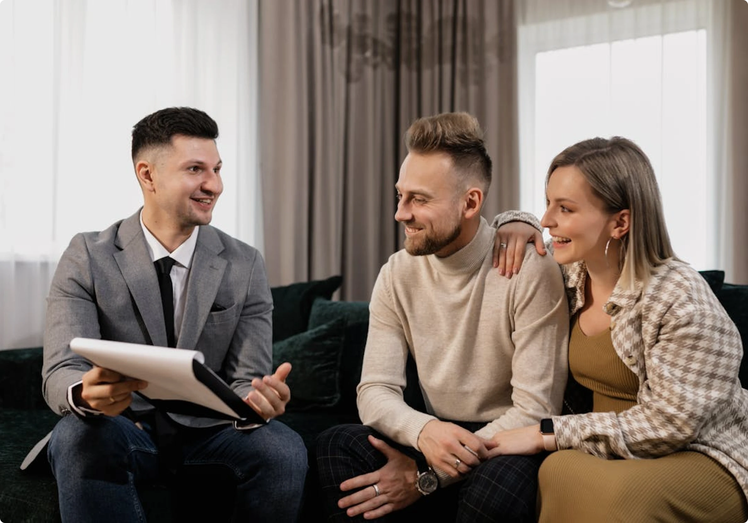 Mortgage broker from MambaCap Financial discussing home loan and real estate financing options with a couple seeking mortgage solutions.